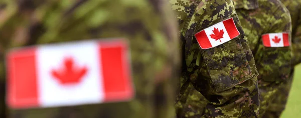 Canada Day. Flag of Canada on the military uniform and red Maple leaf. Canadian soldiers. Army of Canada. Canada leaf. Remembrance Day. Poppy day.