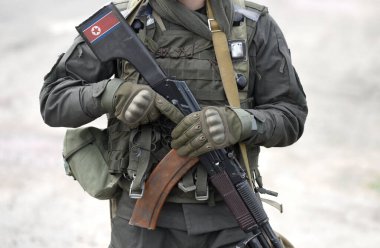 Flag of North Korea on assault rifle butt. Military, army, armed forces, soldiers. Collage. 