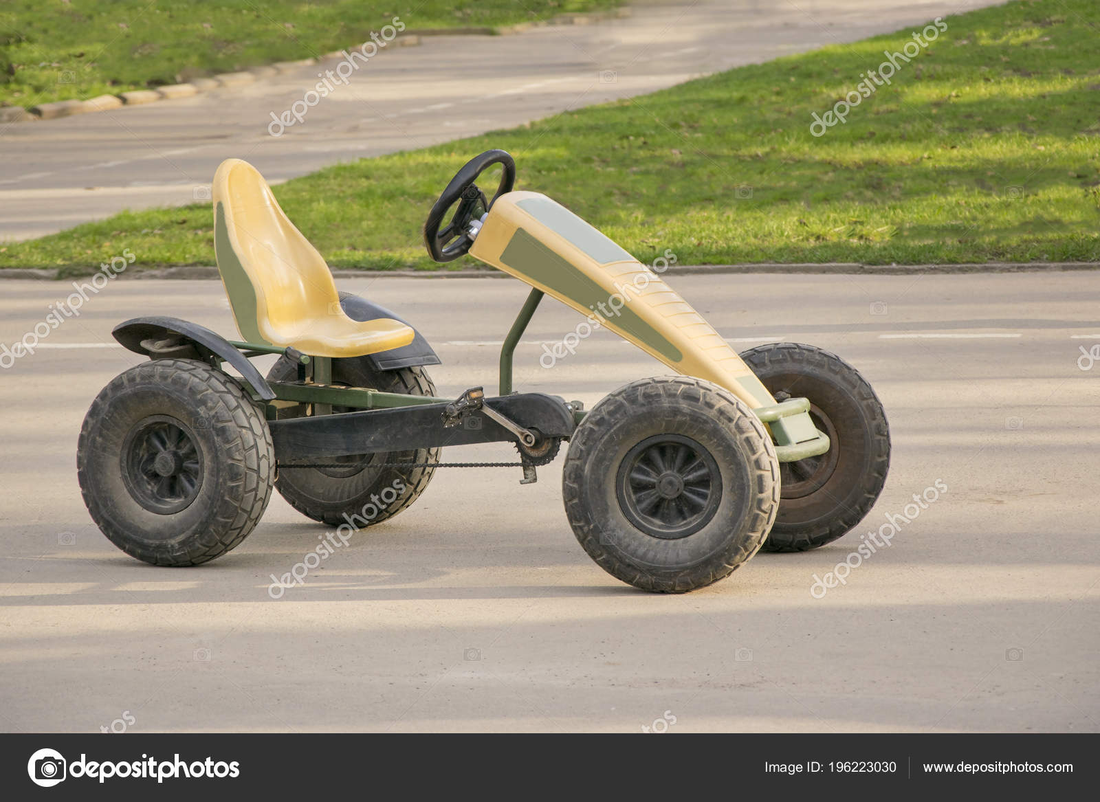 Small car with pair of pedals and chain on gears — Stock Photo