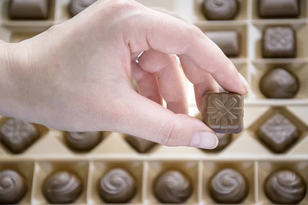 Woman hand holding sweet candy