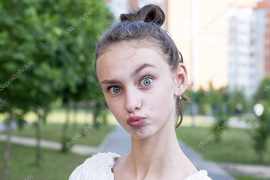 Girl keeps lips as going to kiss someone