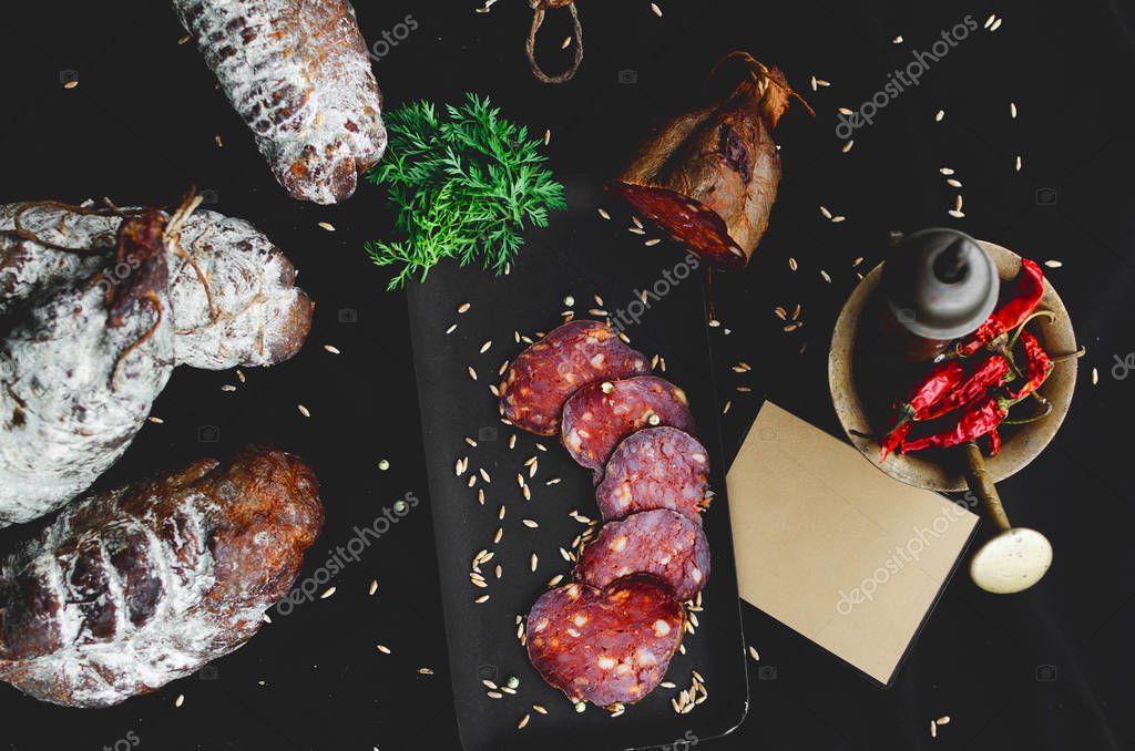 Smoked meat on black background with text place