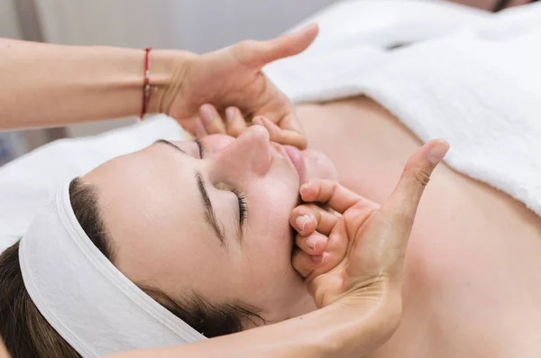 Close Young Woman Lying Massage Table Receiving Face Massage Beauty — Stock Photo, Image