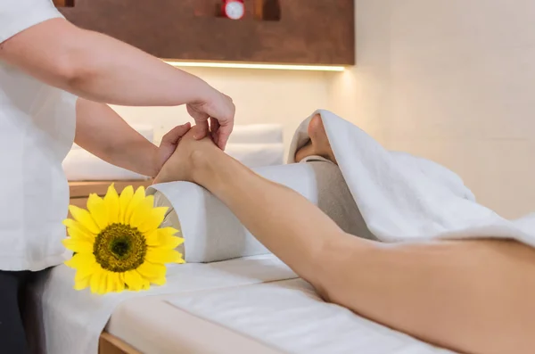 Woman receiving a foot massage at the health spa.