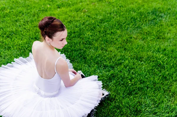 Beautiful Young Ballerina Sitting Green Field White Tutu Space Text — Stock Photo, Image