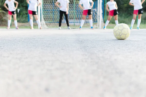Cropped image of young handball players warming up.