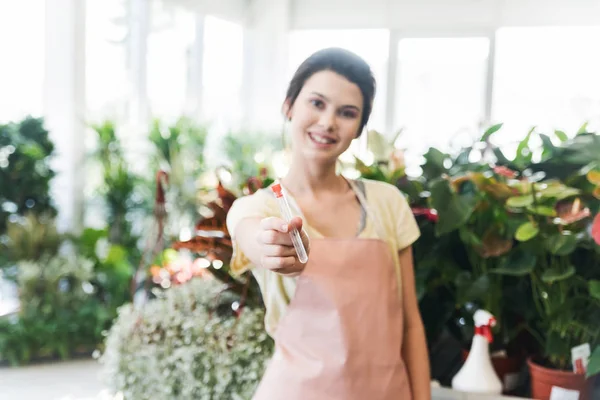 Enthusiastic Young Female Gardener Holding Showing Test Tube Plant Supplements — Stock Photo, Image