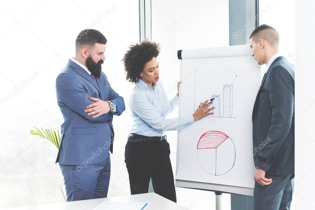 business people working with financial charts in conference room