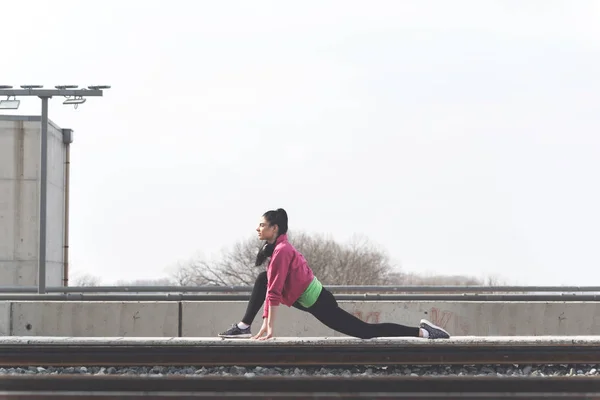 Beautiful Sporty Girl Stretching Warm Jogging Outdoors — стоковое фото