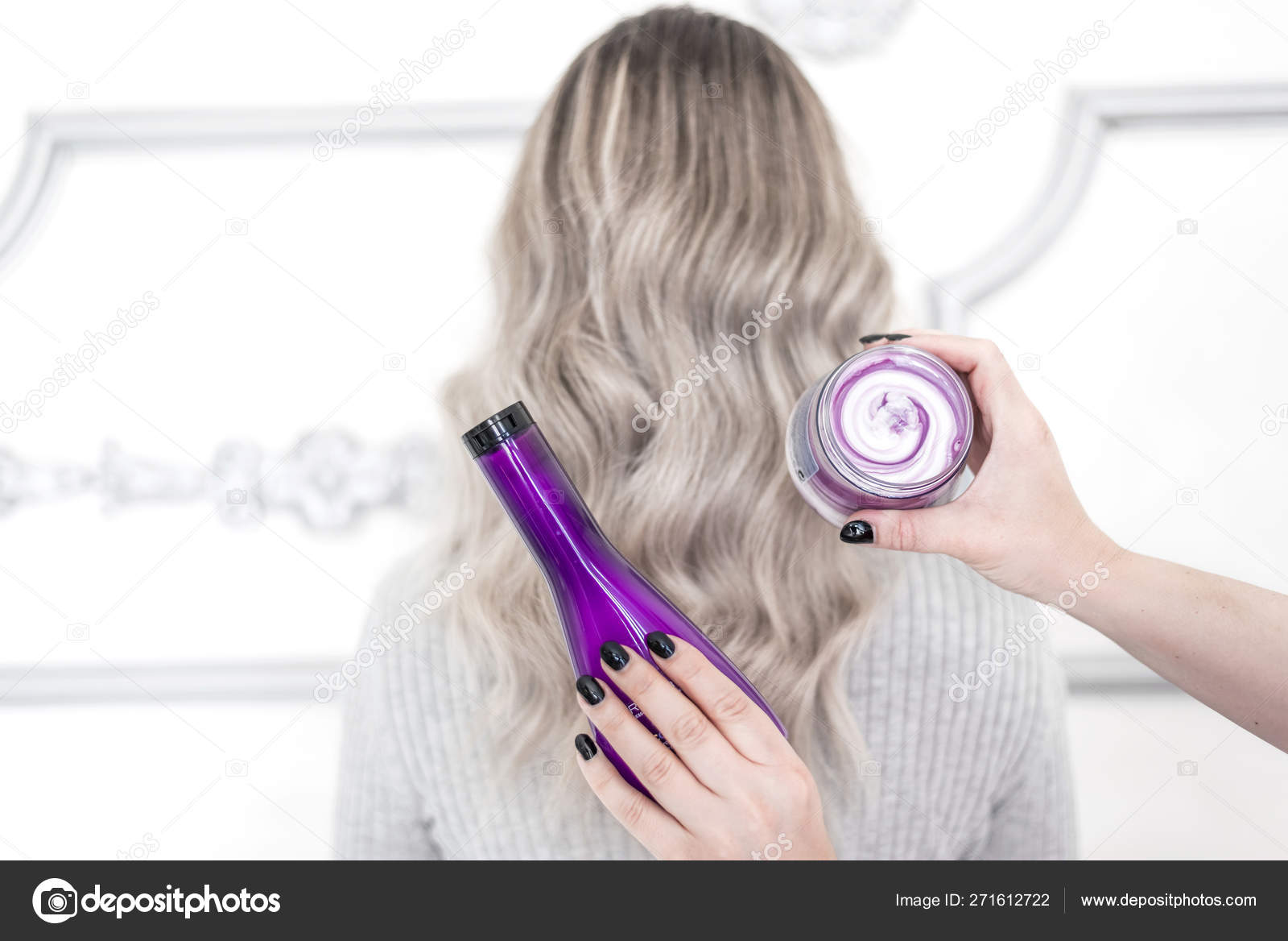 Female Hands Holding Cosmetic Products Colored Hair Back View