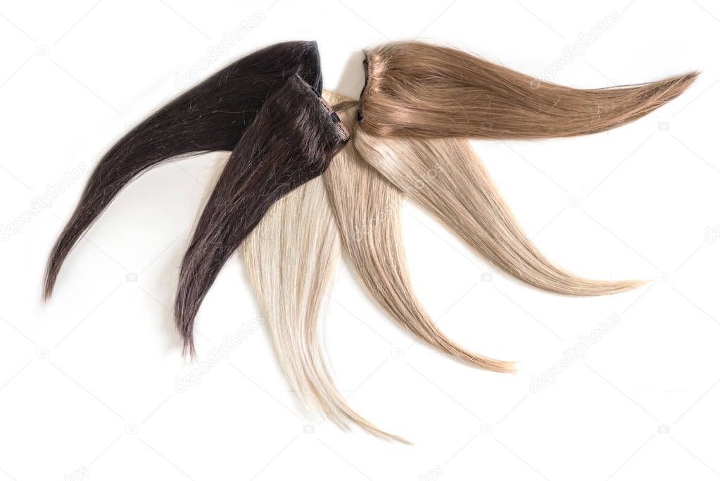 Samples of hair extensions in different colors isolated on white background