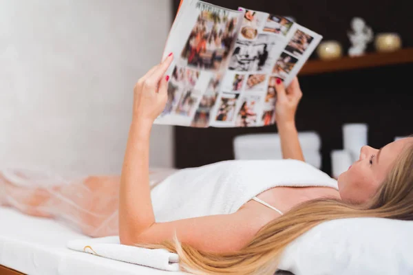 Young Beautiful Woman Lies Relaxes Magazine Space Text Blurred Background — 스톡 사진