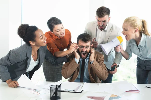 Colleagues criticizing boss for his wrong decision making