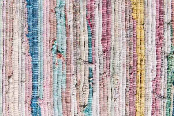 A lot of different colorful cloth stitched together. Abstract background. Old mattress. Vintage handmade rug or carpet.