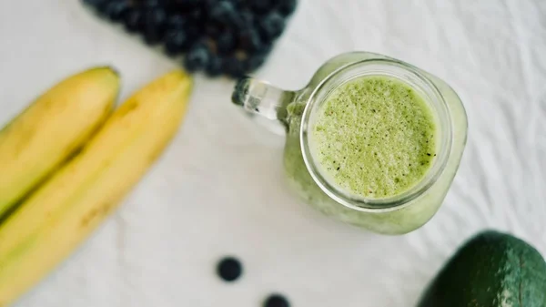 Green Avocado Banana Blueberries Smoothie Glass Jar White Background Healthy — Stock Photo, Image