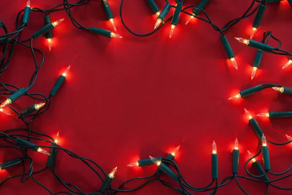 Old Christmas Decorative Lights Red Surface Dimmed Shine Framing Copy — Stock Photo, Image