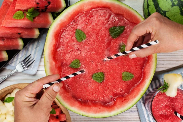Half watermelon carved out and filled with melon juice smoothie — Stock Photo, Image