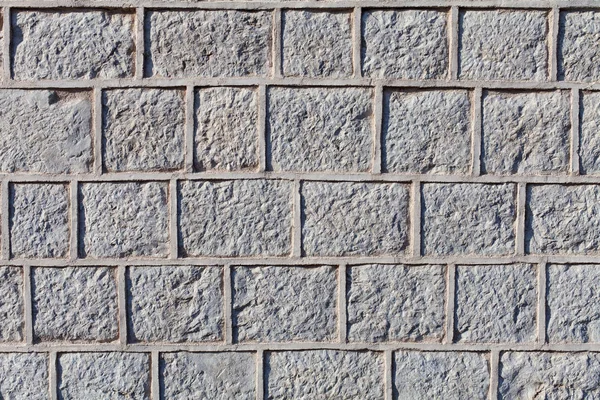 Гнуті кам'яні блоки або цегляна поверхня з цементною затіркою — стокове фото