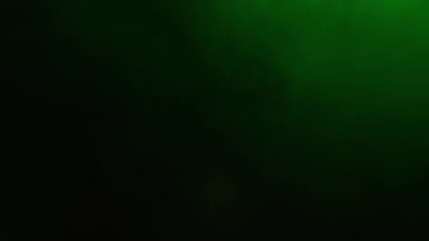 Abstract Forms of Smoke on Black Background. La couleur vert clair illumine la fumée. — Video