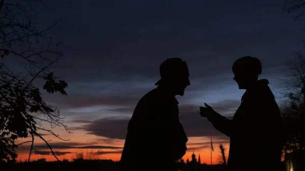 Romantic Date At Night. Boyfriend And Girlfriend Kiss And Hug.They Are Joking.