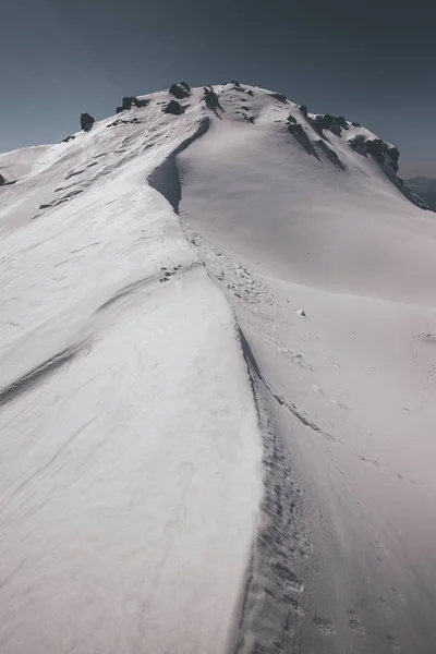 snocapped mountains - outdoor activity - winter mood