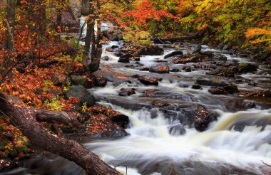 Water falls in rural Quebec in autumn time clipart
