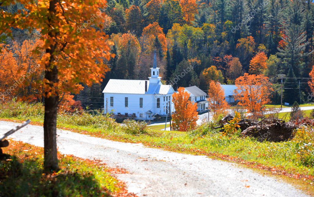 Historic church in West Barnet village in Vermont during autumn time