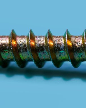 Mavi arkaplan üzerinde wod için kendi kendine dokunuş vida aşırı yakın görünüm.