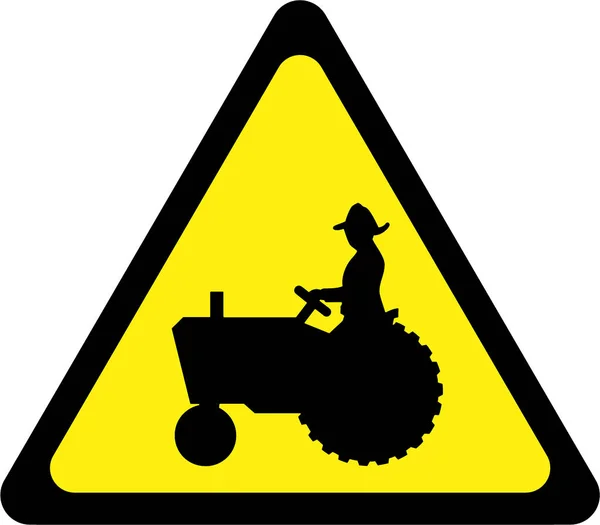Предупреждающий знак с сельскохозяйственным трактором — стоковое фото