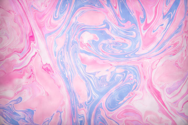 Abstract colored background. Stains of paint on the water. Ebru art, marbled paper.