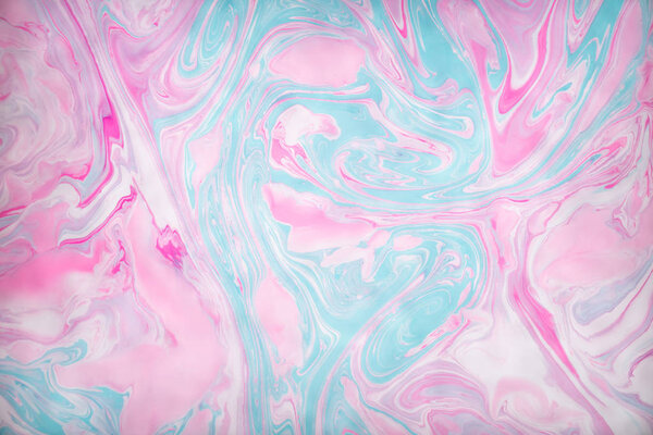 Abstract colored background. Stains of paint on the water. Ebru art, marbled paper.