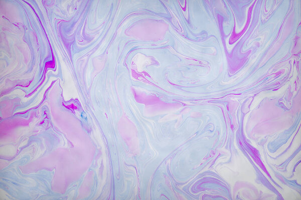Abstract violet marble background. Stains of paint on the water.