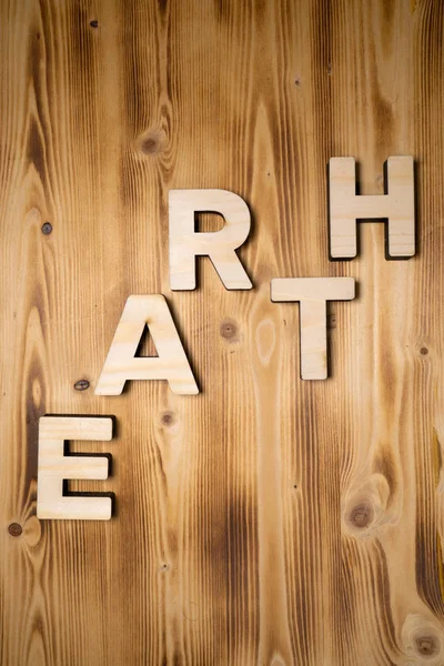 積み木木の板で作られた地球の言葉 — ストック写真