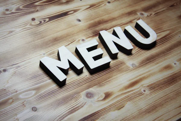 MENU palavra feita com blocos de construção em placa de madeira — Fotografia de Stock