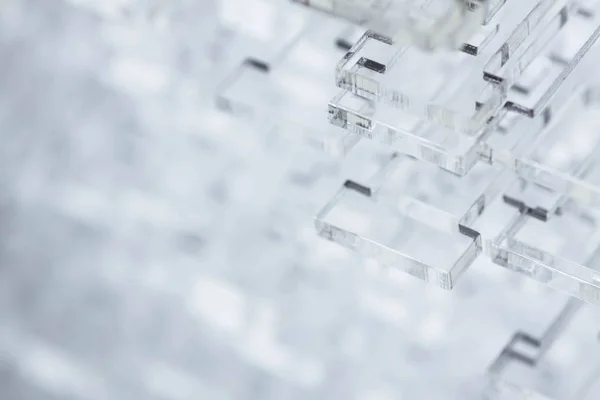 Fond abstrait de haute technologie. Détails en plastique transparent ou en verre. Découpe laser de plexiglas . — Photo