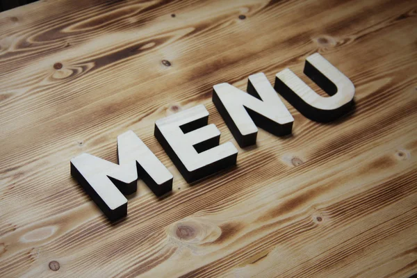 MENU word made with building blocks on wooden board — Stock Photo, Image