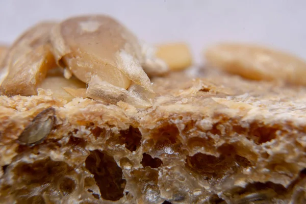 Bread crust with seeds macro. Bread extreme close-up. — Stock Photo, Image