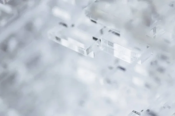 Abstrakt högteknologiska bakgrund. Detaljer av transparent plast eller glas. Laserskärning av plexiglas. — Stockfoto