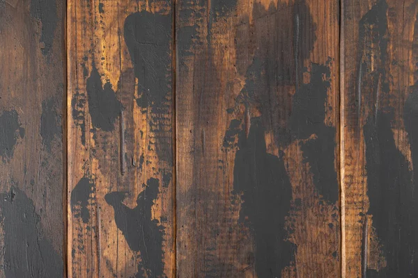 Old wooden surface background, scuffed boards with black paint stains. — Stock Photo, Image