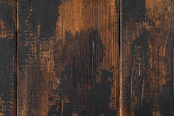 Old wooden surface background, scuffed boards with black paint stains. — Stock Photo, Image