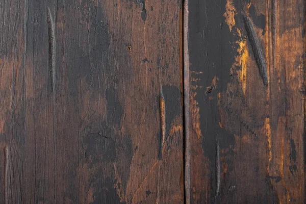 Vieux fond de surface en bois, planches éraflées avec des taches de peinture noire . — Photo