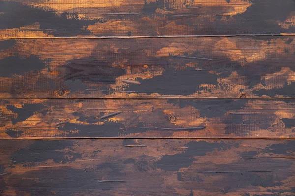 Old wooden surface background, scuffed boards with black paint stains. — Stock Photo, Image