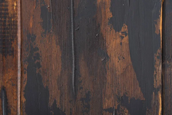 Old wooden surface background, scuffed boards with black paint stains. — Stock Photo, Image