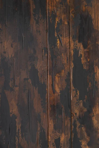 Old wooden surface background, scuffed boards with black paint stains. — Stock Photo, Image