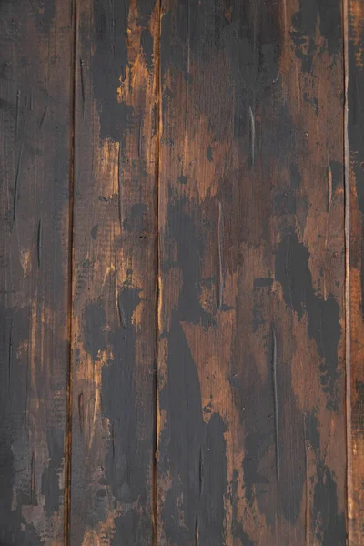 Old wooden surface background, scuffed boards with black paint stains. — Stock Photo, Image