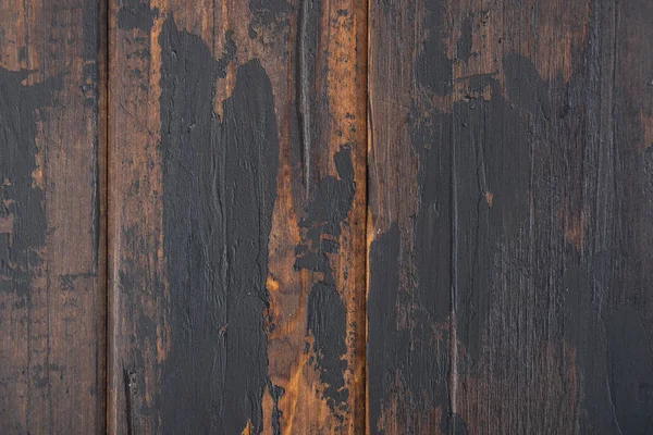 Old wooden surface background, scuffed boards with black paint stains. — Stock Photo, Image