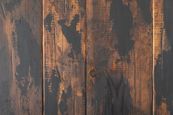 Old wooden surface background, scuffed boards with black paint stains. — Stock Photo, Image