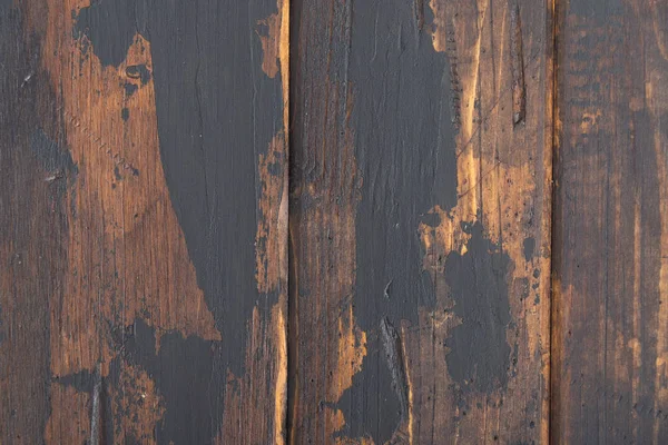 Old wooden surface background, scuffed boards with black paint stains. — Stock Photo, Image