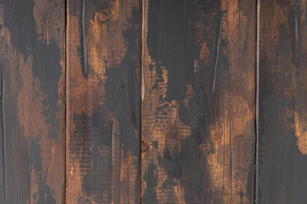 Old wooden surface background, scuffed boards with black paint stains. — Stock Photo, Image