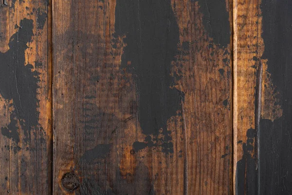 Old wooden surface background, scuffed boards with black paint stains. — Stock Photo, Image